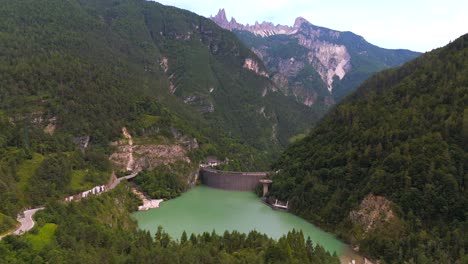 soaring above pontesei dam, the video highlights the impressive scale of the reservoir nestled amidst rugged mountains, offering a breathtaking view of its engineering and natural beauty