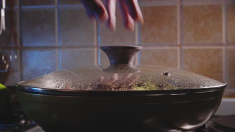 cooking chicken noodles in a pan