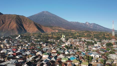 aerial over sembalun village with mount gunung rinjani in background, lombok