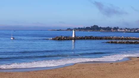serene beach scene with lighthouse