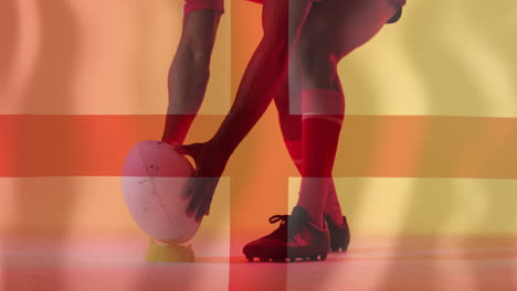 animation of flag of england over biracial male rugby player holding ball