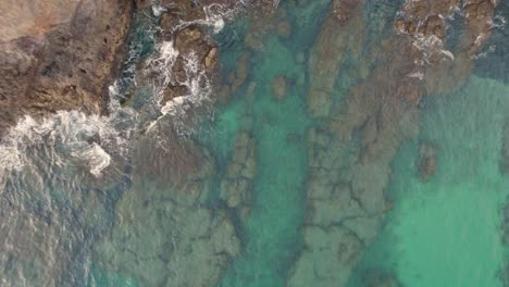 Waves-of-Atlantic-Ocean-crashing-against-the-rugged-rocks-of-the-papagayo-beach