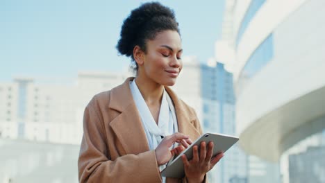 businesswoman using tablet in city