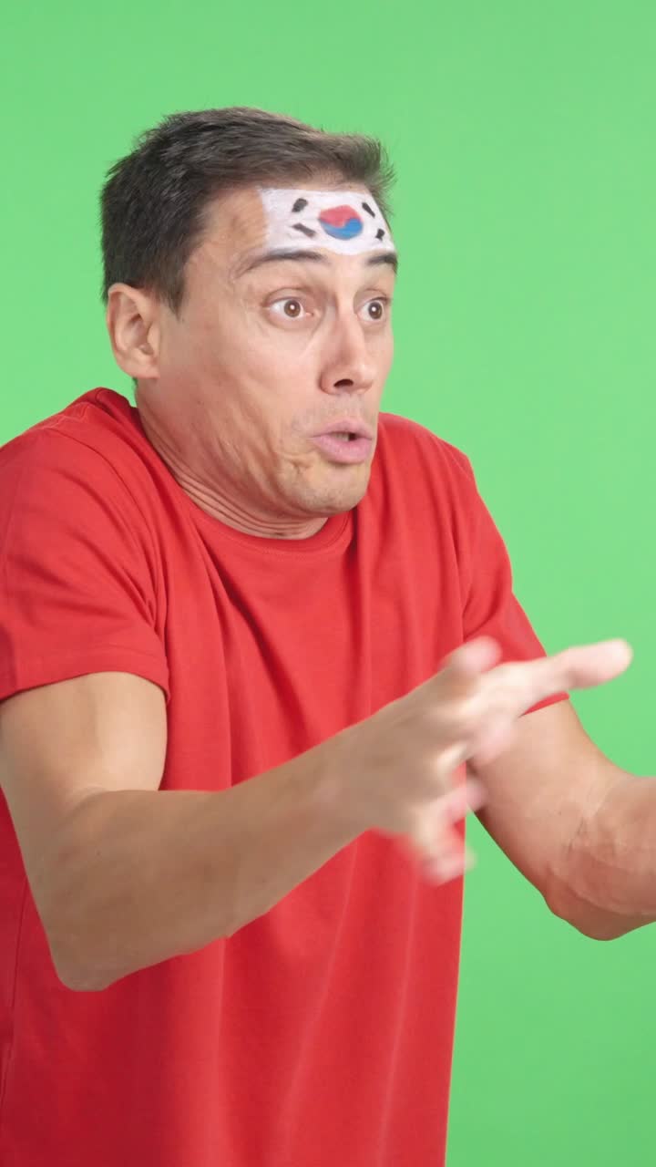 Man cheering for South Korea, angry with the decision of referee