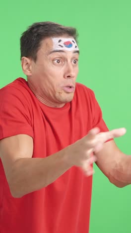 man cheering for south korea, angry with the decision of referee