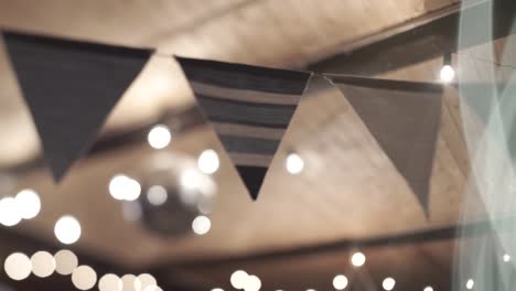 rustic party decorations with string lights and flags