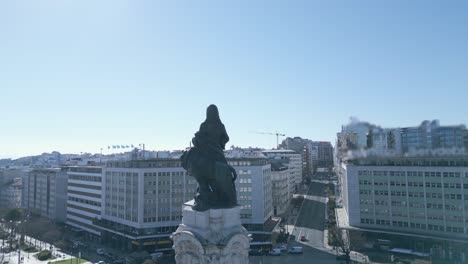 aerial, closeup, drone shot around the marques de pombal statue, liberty avenue park in background, sunny day, in lisbon, portugal