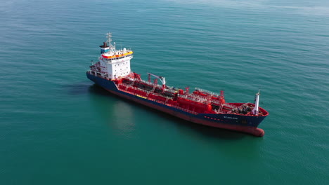 close up aerial shot over a oil tanker petroleum ship moving gasoline