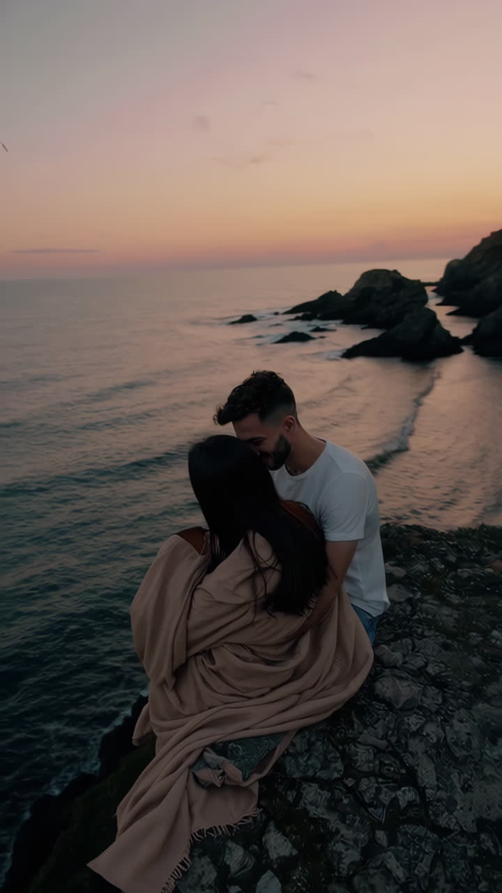 Couple Enjoying Romantic Sunset by the Ocean
