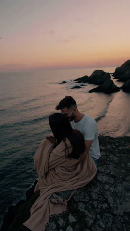 couple enjoying romantic sunset by the ocean