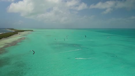 Drone-shot-group-people-Kiteboard-in-caribbean-sea,-Los-Roques-Venezuela