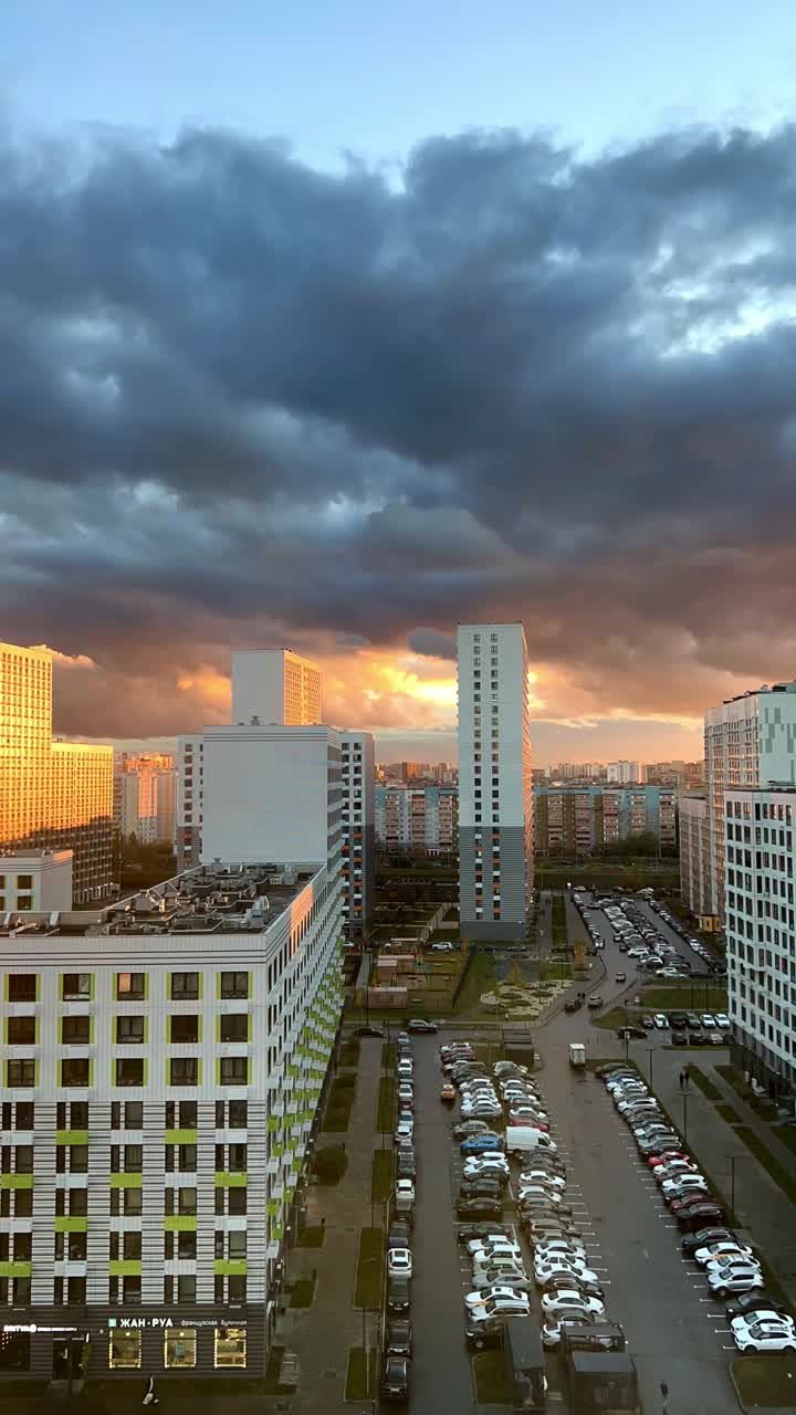 Cityscape at Sunset with Buildings and Cars