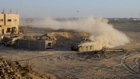 driving armoured vehicles through destroyed gaza city with bombed buildings