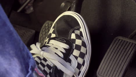 a man's foot pressing accelerator and brake pedal, honda car, tokyo, japan