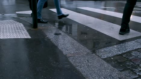 slow motion of pedestrian crossing the rainy street in paris