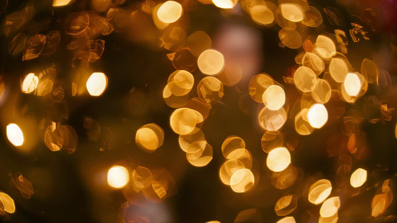 Shimmering bokeh drifting from focus drift in dim room closeup, showing string lights ornaments