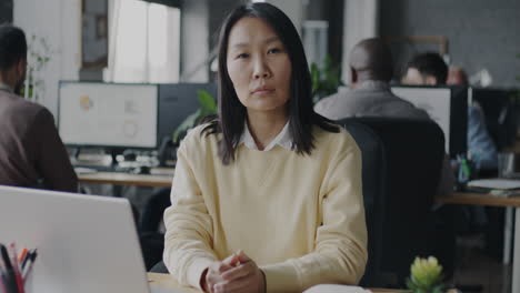 asian woman working in modern office