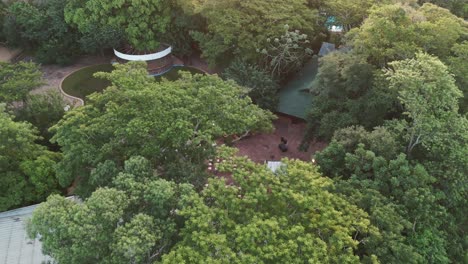 A-parallax-drone-shot-of-the-green-environment-with-an-amazing-wedding-decoration-in-the-middle-of-the-Paraná-River-in-Posadas,-Misiones