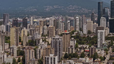 vancouver bc canada aerial v121 zoomed tracking shot flyover false creek capturing cityscape across downtown and west end against harbour and mountain backdrop - shot with mavic 3 pro cine - july 2023