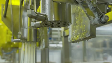 close up of refining, filling and packing process of palm kernel oil with worker background at factory, malaysia