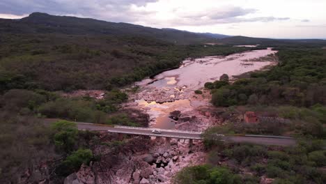 drone-video-of-car-on-the-road-from-Lençóis-to-Ibicoara,-Vale-do-Pati,-Chapada-Diamantina,-Bahia,-Brazil