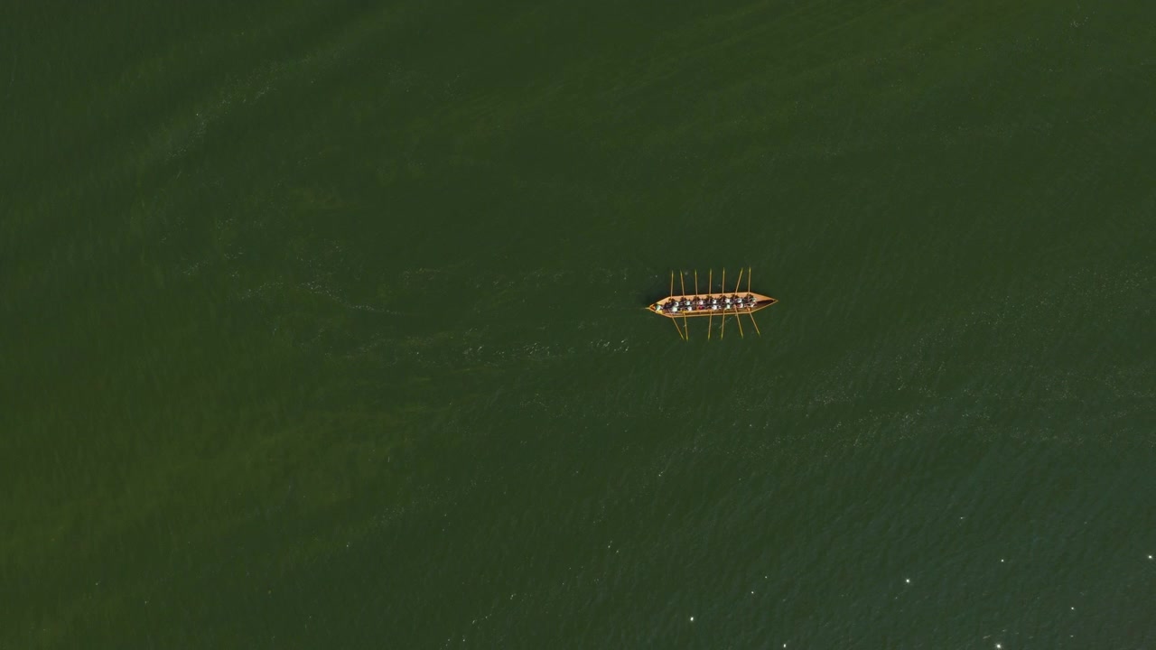 Top down drone shot above a Viking row boat in Hiittinen, Finnish archipelago
