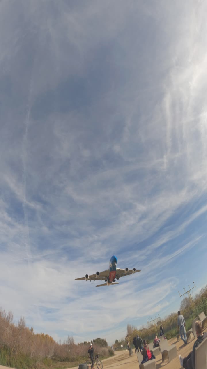 Airplane Landing Over a City Park