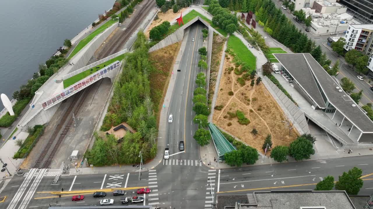 Drone shot of Seattle's downtown Sculpture Park, cars driving on Elliott Ave