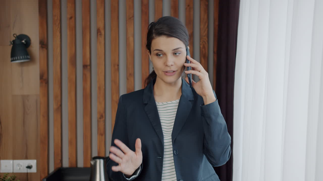 Business Woman on Phone in Hotel Room