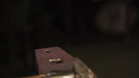 blacksmith shaping a horseshoe