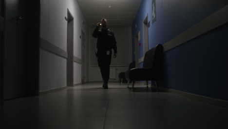 man in uniform working on the corridor