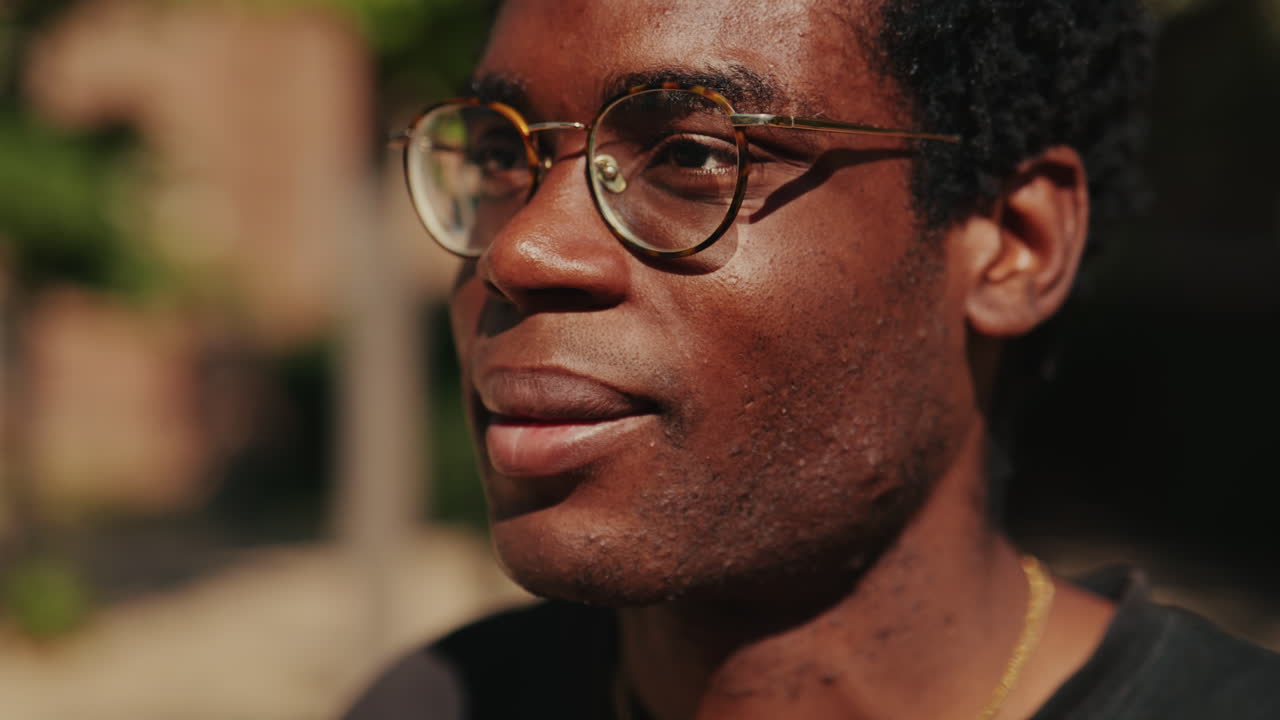 Close-up Portrait of a Young African American Man Wearing Glasses