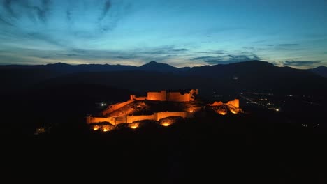 flying towards an illuminated castle at dusk