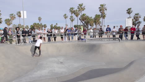 tracking a skater as he navigates venice beach skatepark. slow motion