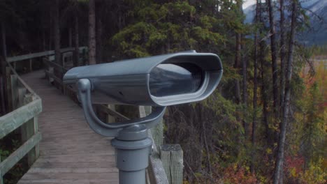 boardwalk with coin operated binoculars in autumn close up