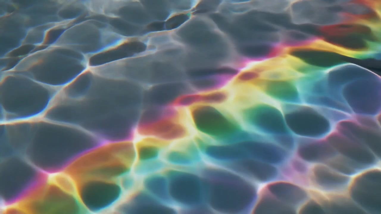 Rainbow Light Refraction on Rippling Water Surface