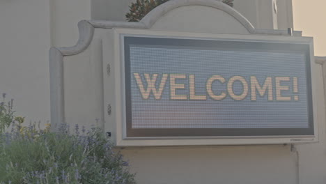 Electronic-billboard-sign-on-the-exterior-of-a-church-inviting-to-celebrate-Sunday-mass