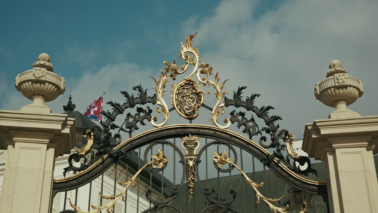 A decorative wrought iron gate with gold detailing at the Presidential Palace in Bratislava