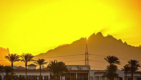 albatros beach hotel time lapse with sun rising behind mountain, hurghada egypt