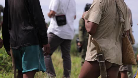 Triba-local-people-in-South-Asia-meeting-outdoor-unrecognizable-faces-carring-machete