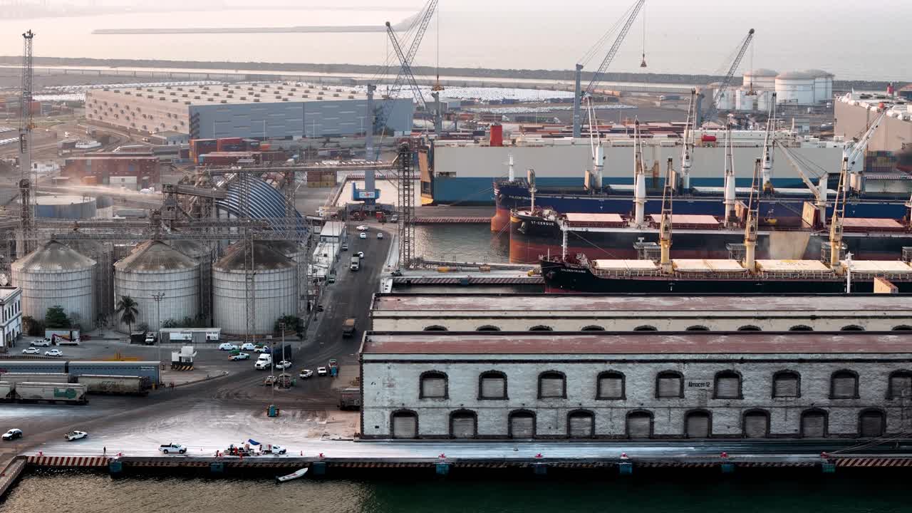 Industrial Port with Cargo Ships and Cranes
