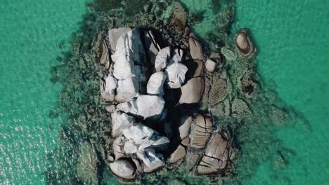 aerial top down view of huge rocks in the sea and turquoise water. beautiful seascape.
