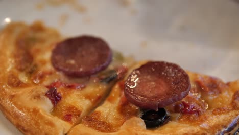 close up of a slice of pepperoni pizza