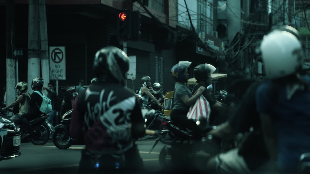 Busy City Street Intersection with Motorbikes and Traffic