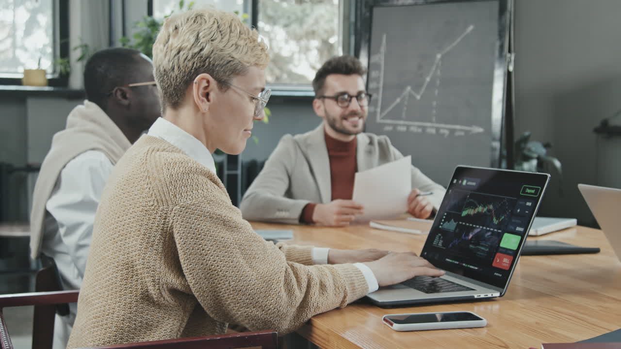Group of Young Investors Having Meeting