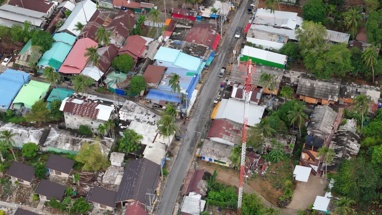 A birds-eye view of Lonely Beach on Koh Chang, Thailand showing the village, shops, main road and guest house accommodation