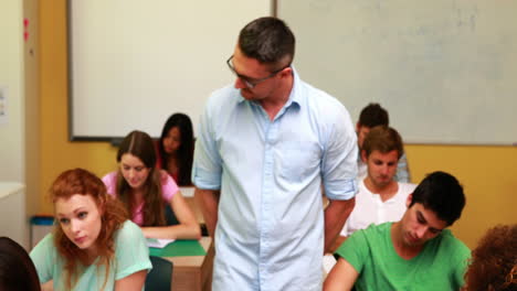 Lecturer-smiling-at-camera-in-classroom