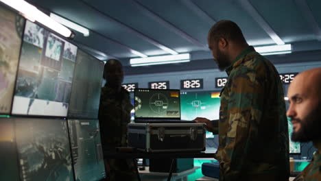 air force officer performing tactical level surveillance in command room