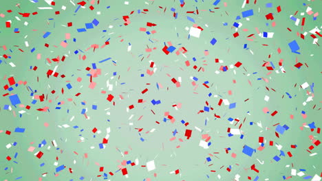 animation of red, white and blue confetti falling on pale green background