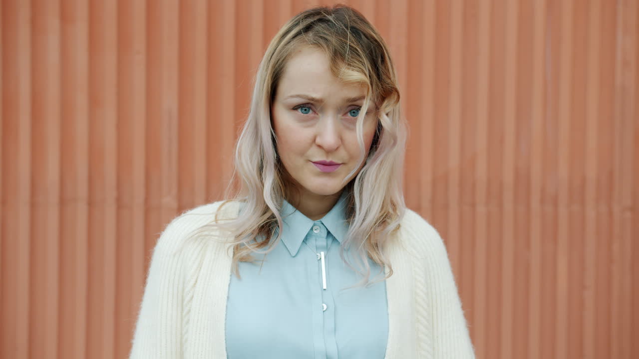 Woman Outdoors with Concerned Expression